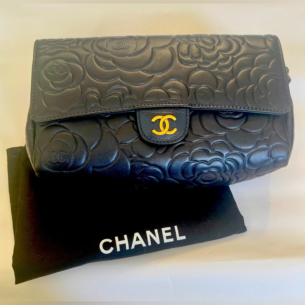 Dark navy Chanel clutch (cosmetic bag) in embossed Camellia lambskin leather